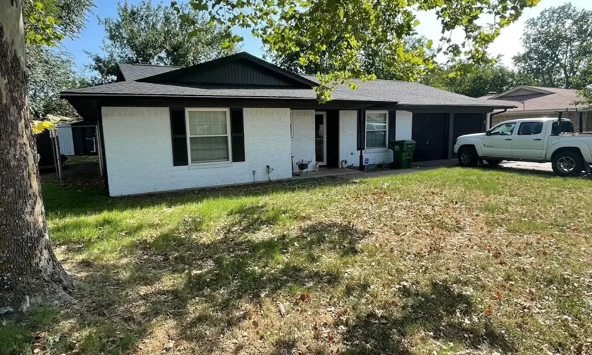 Professional roofing crew working on a residential roof in Shakopee